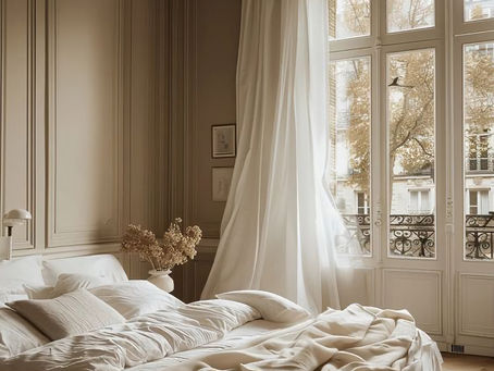 An inviting, decluttered bedroom with a soft, neutral palette