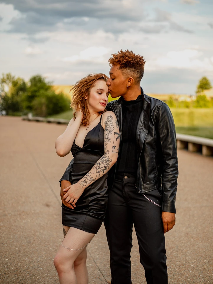 LGBT couple embracing urban St. Louis couples photoshoot