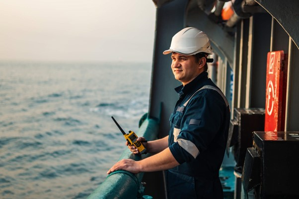 Rig worker holding phone