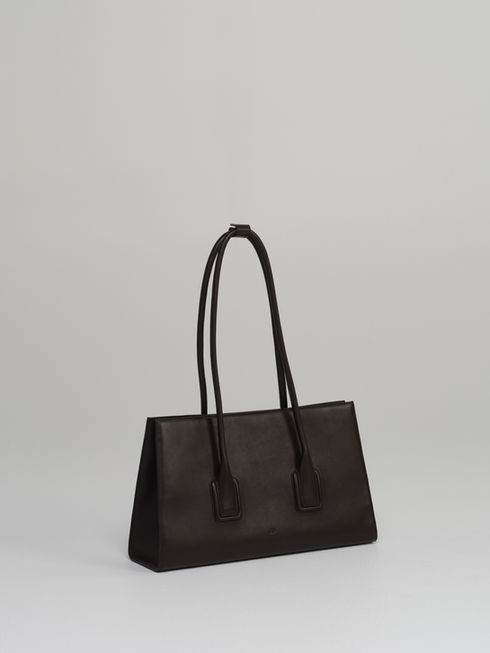 MATEO handcrafted leather tote bag in rich chocolate brown - side view.