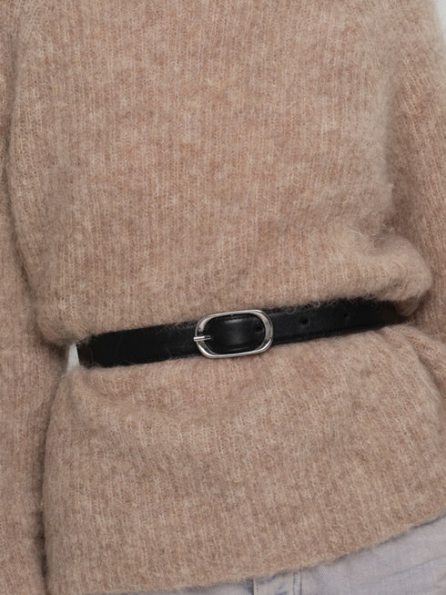 AGNES handcrafted leather belt with oval black in classic black on model for size and scale