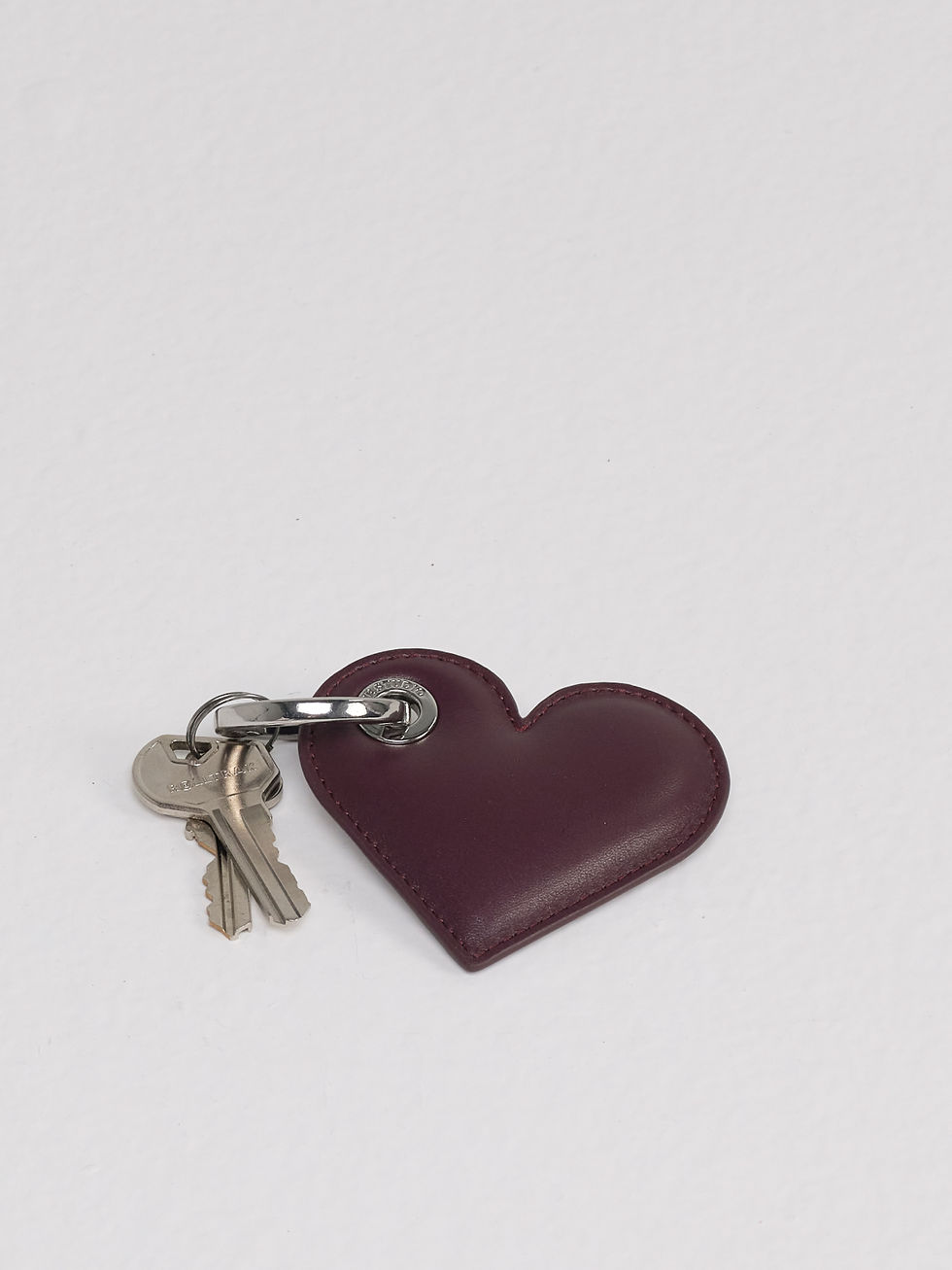 LOLITA heart-shaped leather key ring in deep fig purple with keys for scale