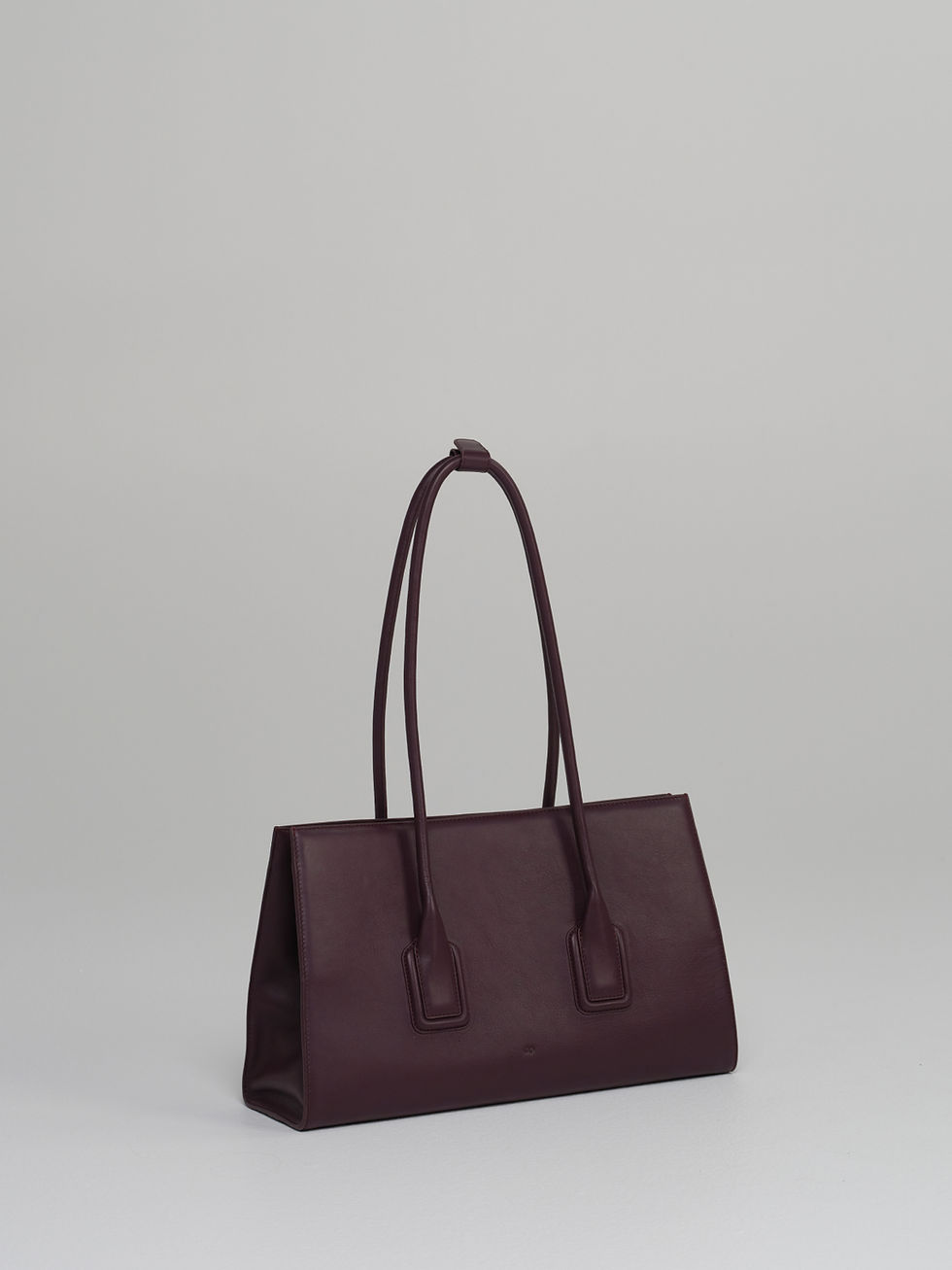 MATEO handcrafted leather tote bag in fig - side view.