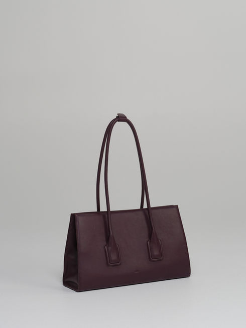 MATEO handcrafted leather tote bag in fig - side view.