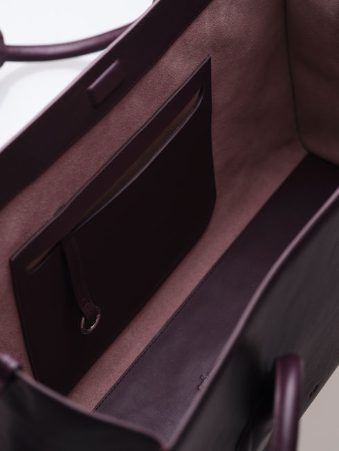 MATEO handcrafted leather tote bag in fig showing internal capacity, internal pocket and details