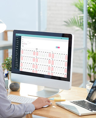 asian-businesswoman-sitting-desk-office-studying-graphs-large-computer-screen.jpg