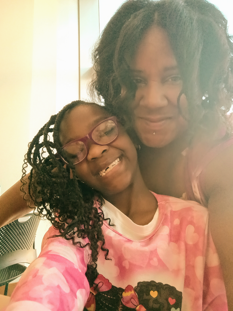 Dr. Michelle D. Dartis with her granddaughter and young co-author, Trinity N. M. Robinson