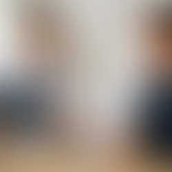 Doctor reviewing a cervical spine X-ray with an insurance adjuster holding an insurance claim form, illustrating how insurance companies evaluate accident-related injuries during a claims investigation.