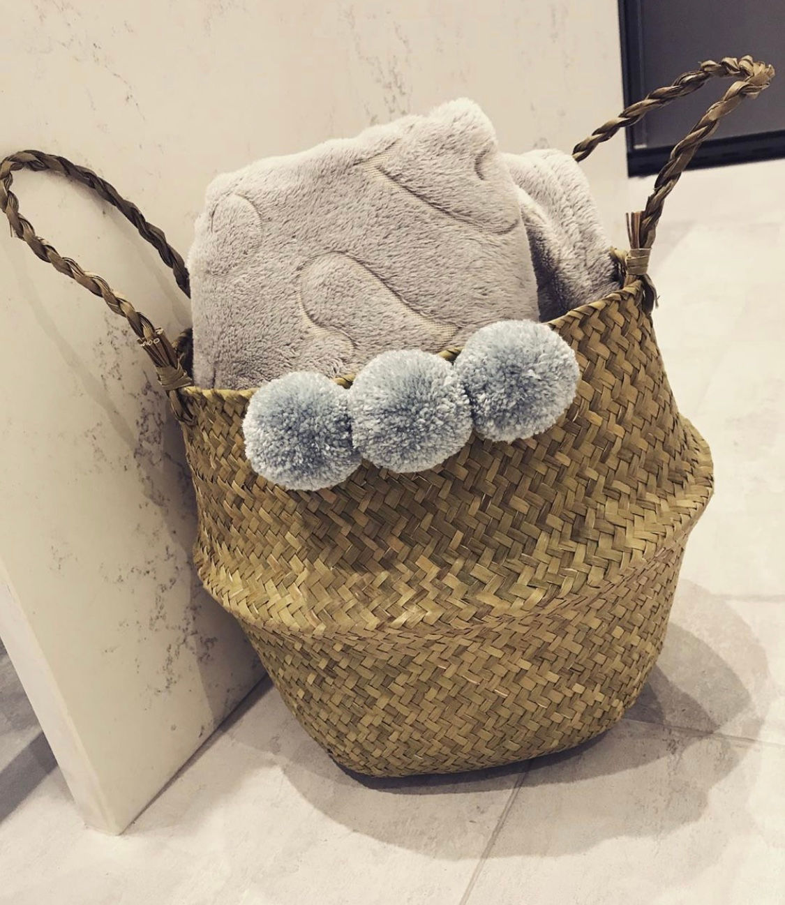 Large basket with large grey Pom poms 30cm high