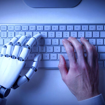hand and robot typing