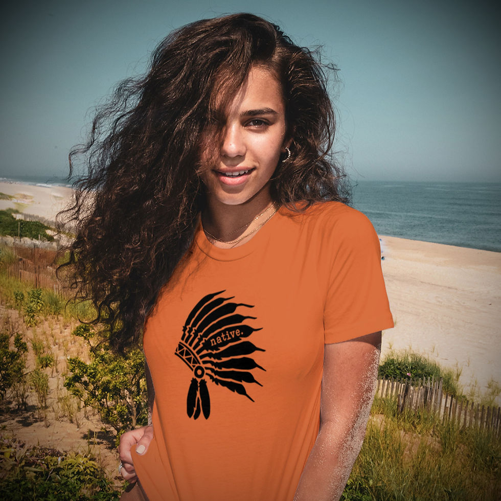 Woman wearing orange shirt with Native Headdress Iron On Decal near beach.