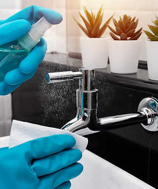 Cleaning staff using alcohol spray faucet Covid 19