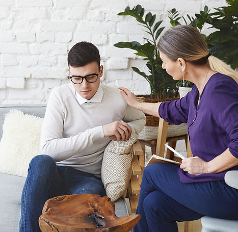 candid-shot-casually-dressed-professional-woman-psychotherapist-her-fifties-touching-her-y