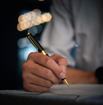 signing-documents-with-a-pen-at-night-2026-03-19-10-37-54-utc.jpg