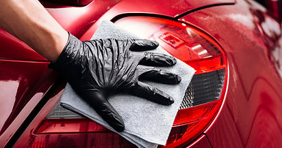 close-up-person-cleaning-car-exterior.jpg