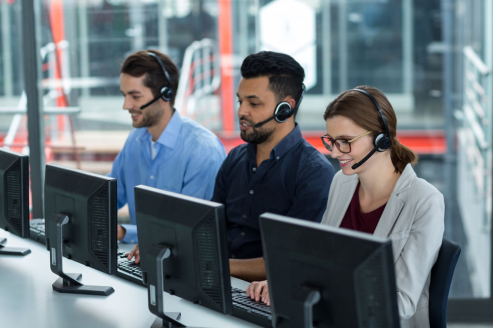 business-executives-with-headsets-using-computers-desk-office.jpg