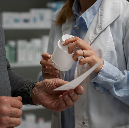 senior-man-consulting-female-pharmacist-medication.jpg