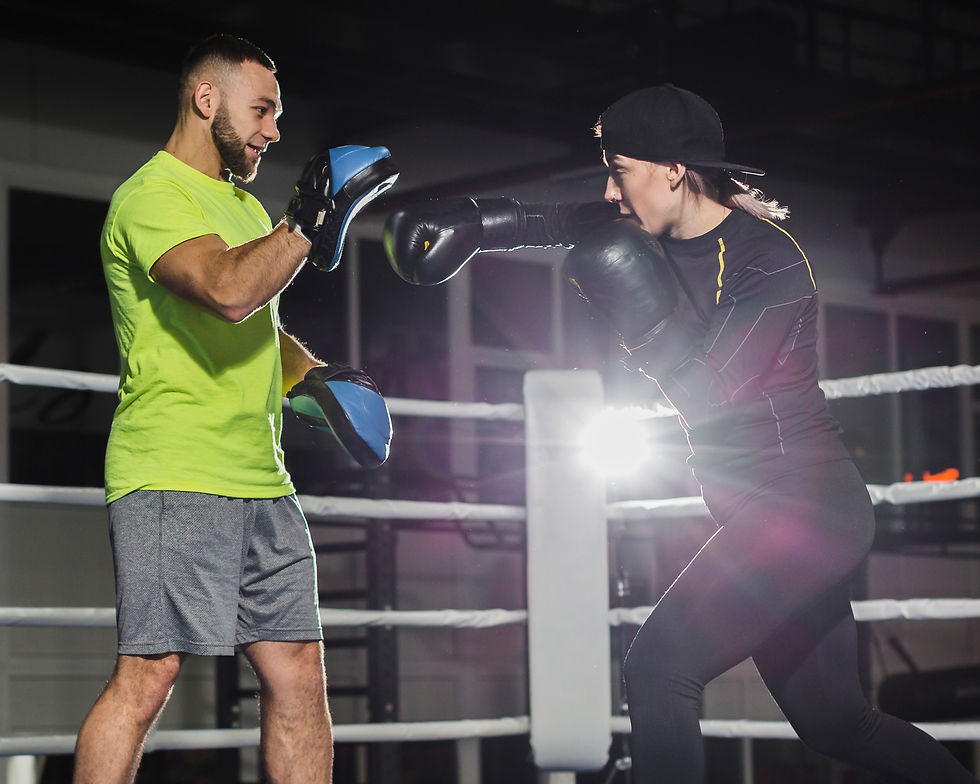side-view-male-trainer-female-boxer-practicing.jpg