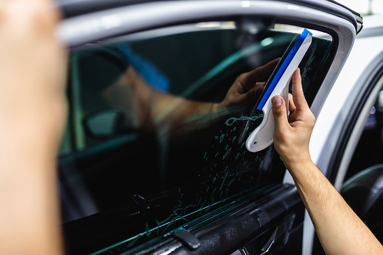car-tinting-worker-applying-tinting-foil-car-window.jpg