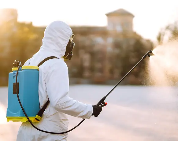 squash_person-in-hazmat-suit-spraying-building-with-sun-2026-03-19-22-08-50
