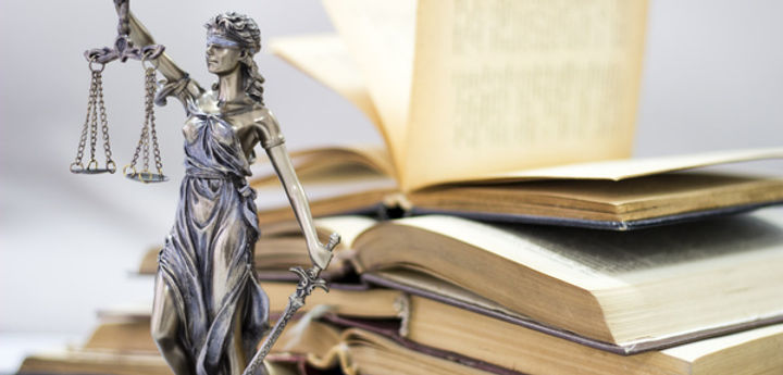 Books, statue, and justice