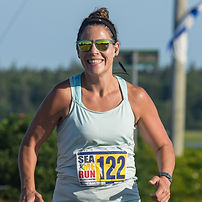Image of a Certified Athletic Therapist that is running a race and smiling