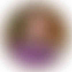 Circular image of Lluis Montoliu against a wall with a green and pink plant