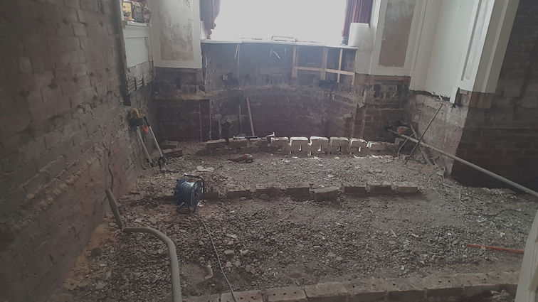 Old sleeper walls joists and flooring stripped out ready for replacing with new_edited.jpg