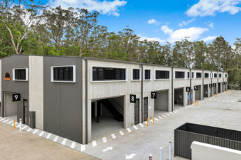 Row of modern commercial units with numbered bays