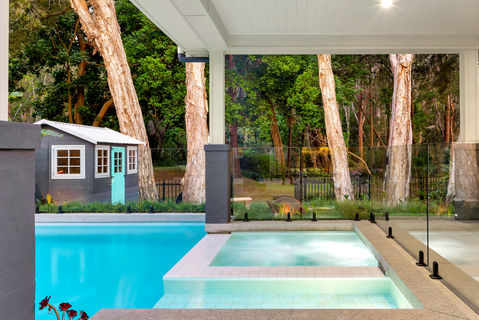 Backyard pool, spa, playhouse, and forest view