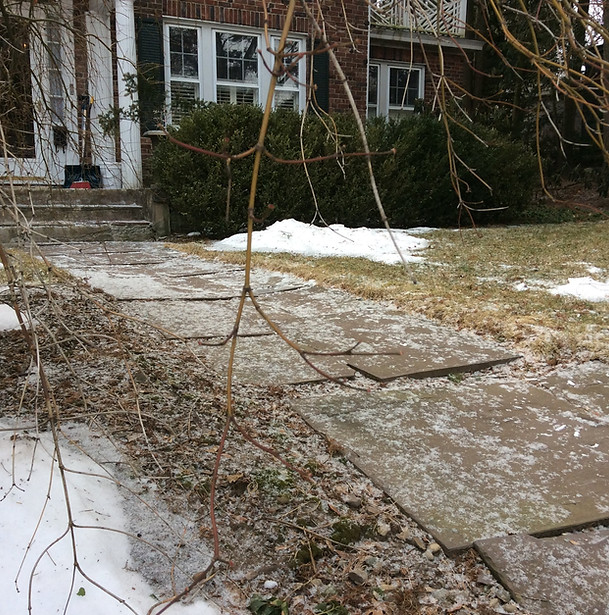 old, faulty stone pathway, before artisan stone & nursery's restoration