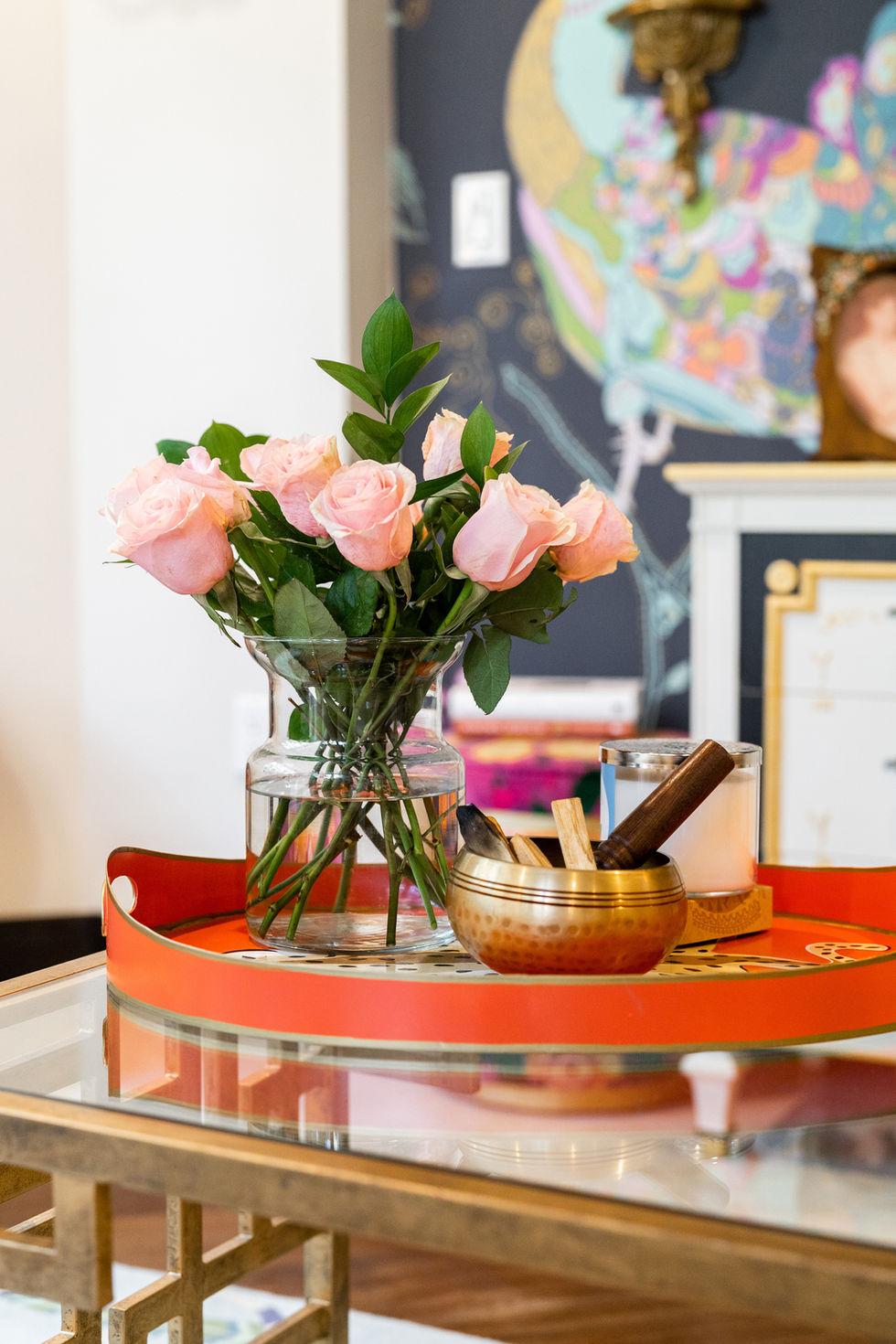 Fresh floral arrangement with colorful accents and styled tabletop by a Miami interior designer