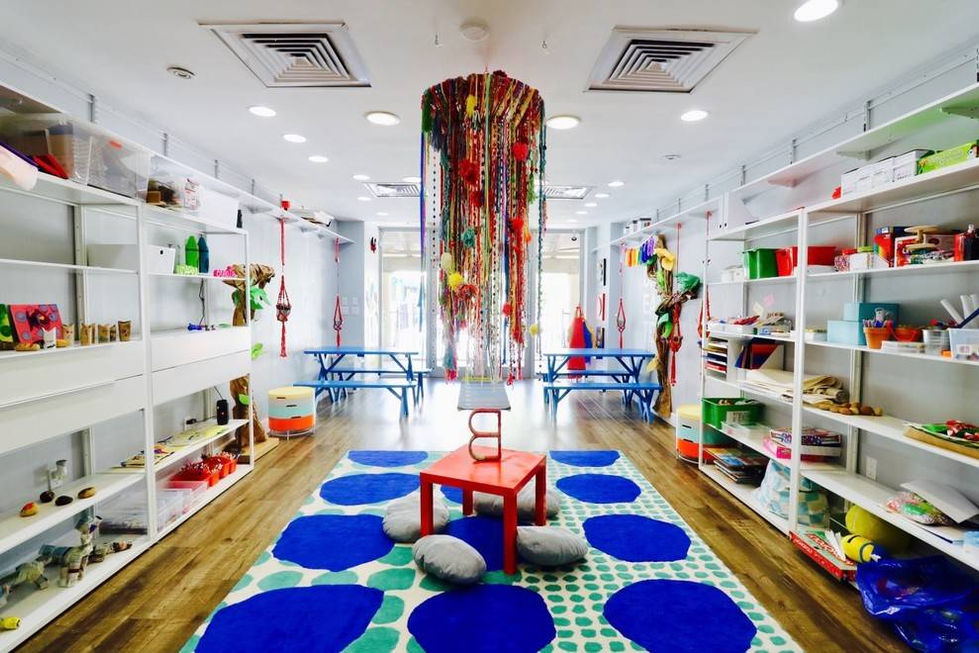 Bright commercial interior in Miami featuring bold colors, sculptural lighting, and an energetic contemporary design