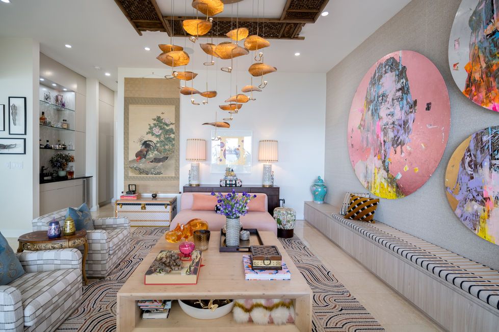 Bright living space featuring sculptural lighting and oversized art inspired by Miami interior design