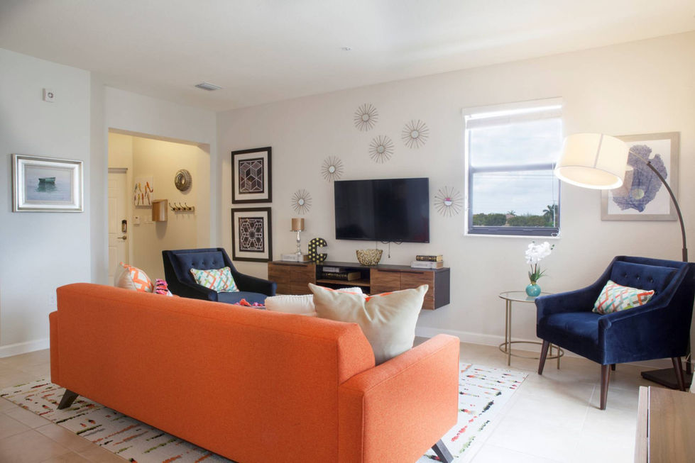 Cozy open living space in Miami featuring warm tones, comfortable seating, and relaxed contemporary styling