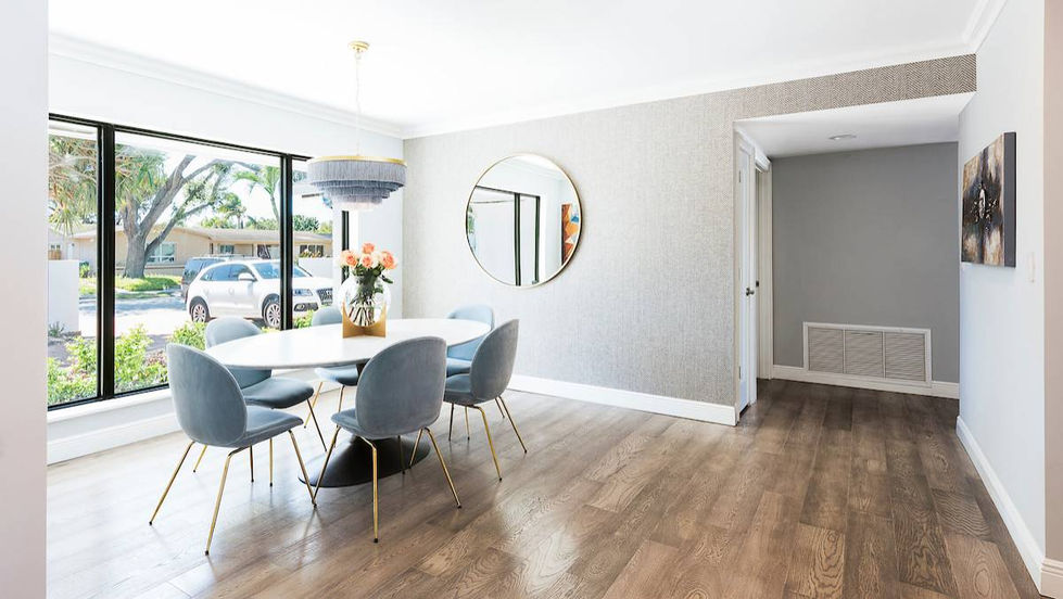 Minimal dining area in Miami featuring clean lines, warm wood floors, and refined contemporary styling