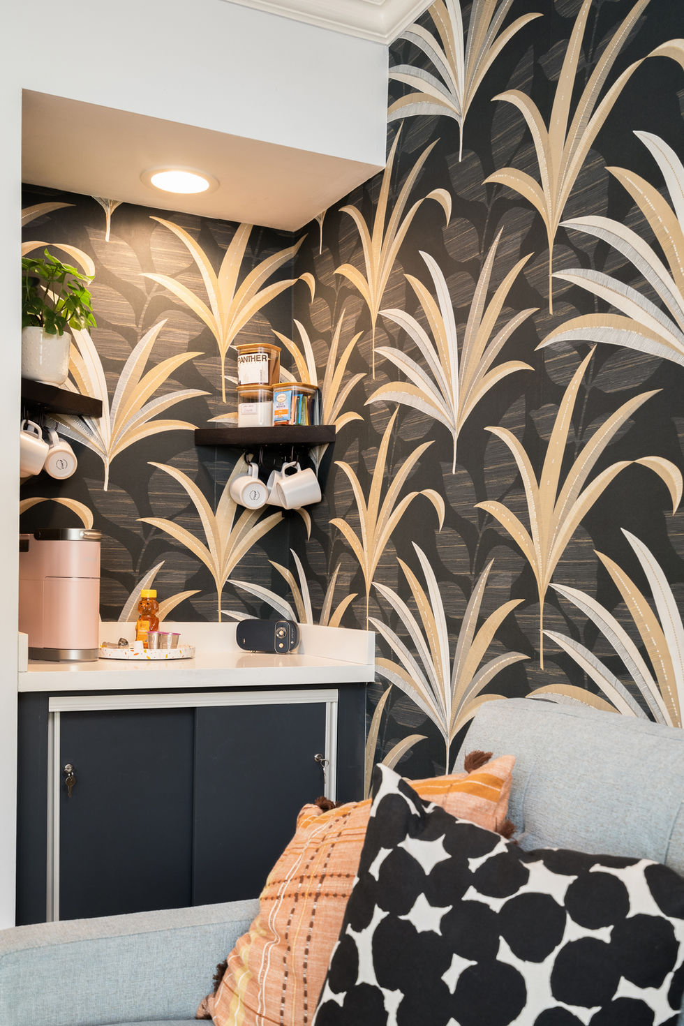 Graphic palm wallpaper in Miami adding depth, contrast, and a tropical modern interior design statement.