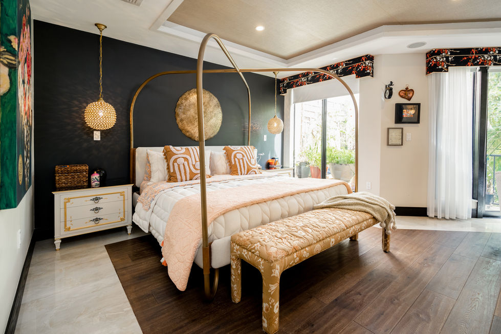 Modern bedroom in Miami featuring sculptural lighting, tailored bedding, and calm contemporary styling