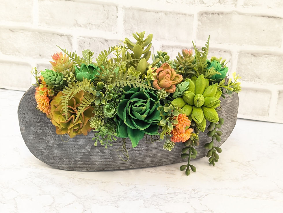 Succulent arrangement in gray planter