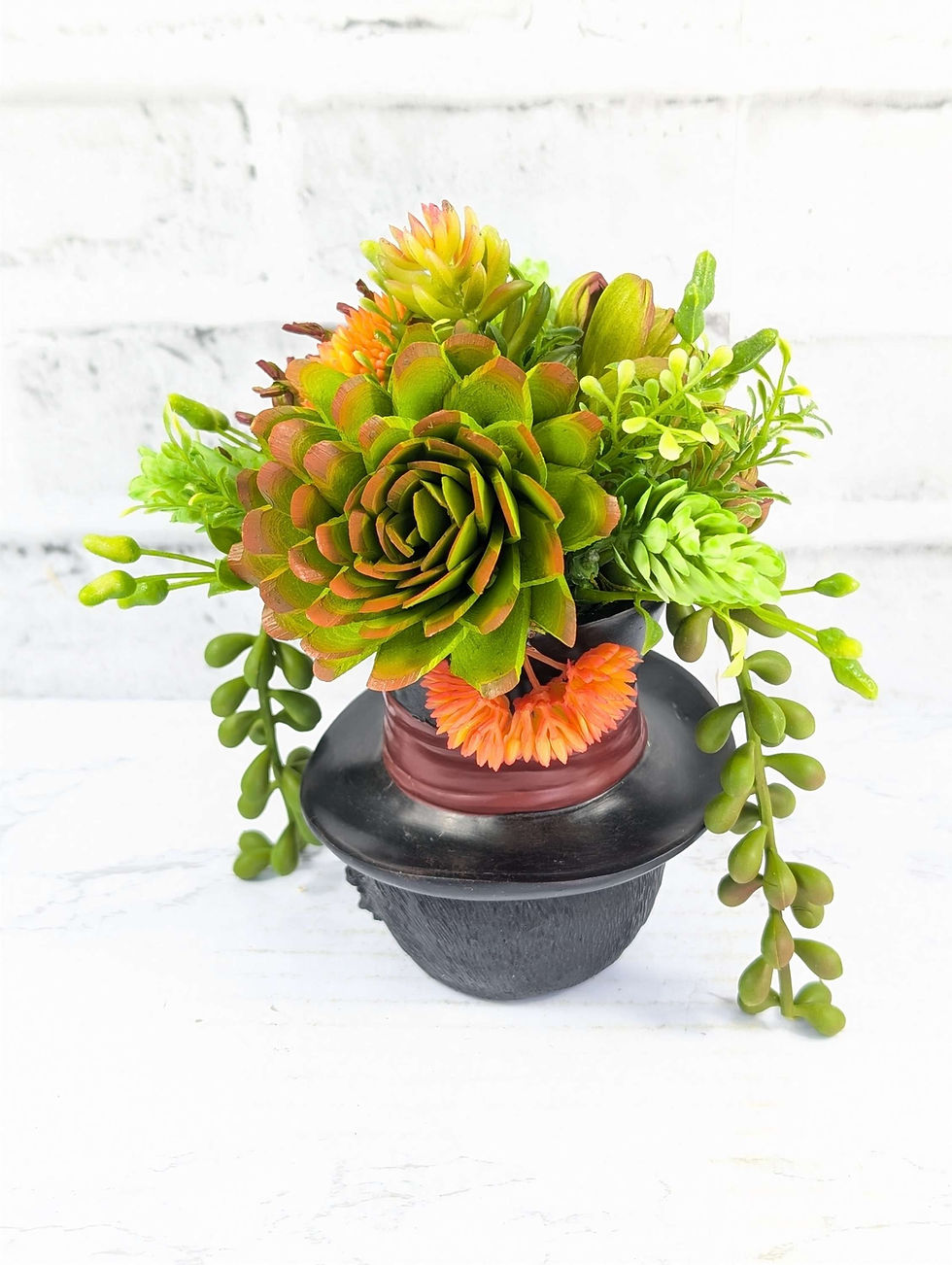 Thumbnail: Succulents in top hat planter