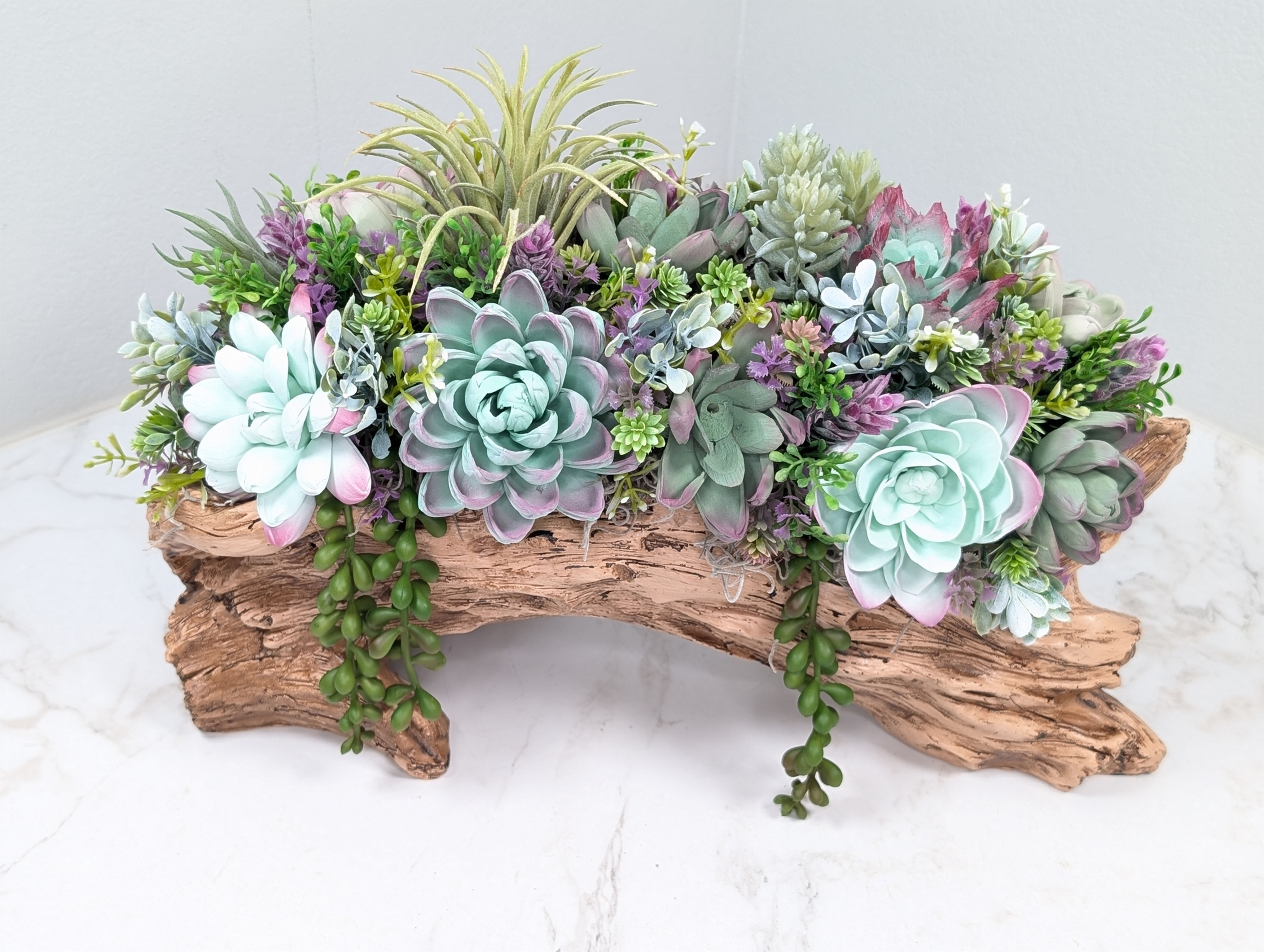 Faux Log filled with wooden succulents