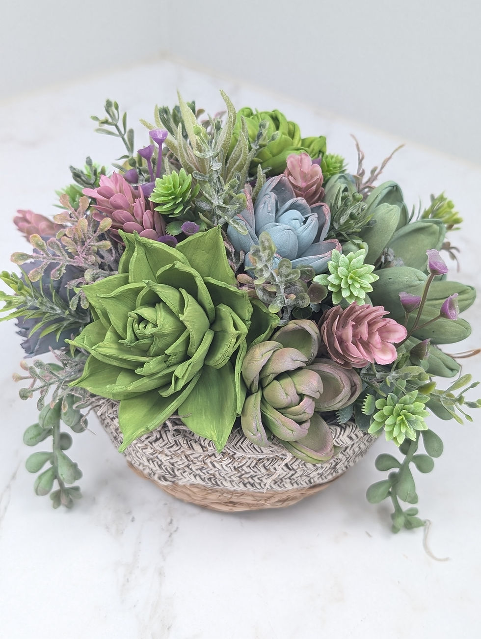 Thumbnail: Round bowl filled with wooden succulents