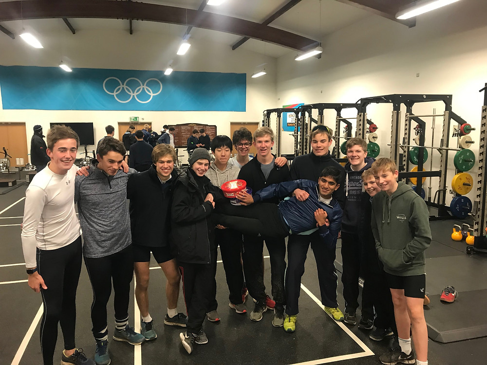 Team One held off throwing the victorious cox (Arnav Jain) in and settled for squatting him!