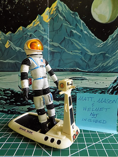 Maj on space sled.png