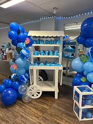 Dessert cart with blue balloons for an event