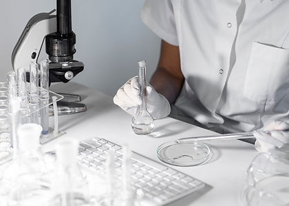 close-up-scientist-holding-glassware.jpg