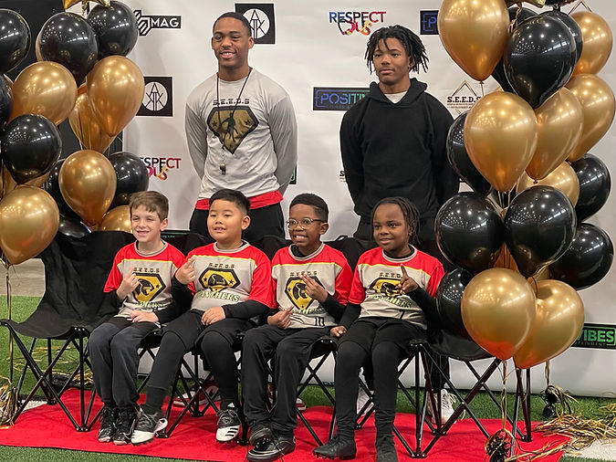 Panthers team on red carpet with sponsor backdrop.jpg
