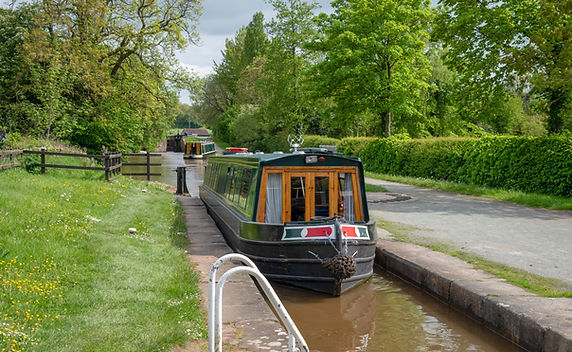 Entering a lock with another narrowboat cloe behind
