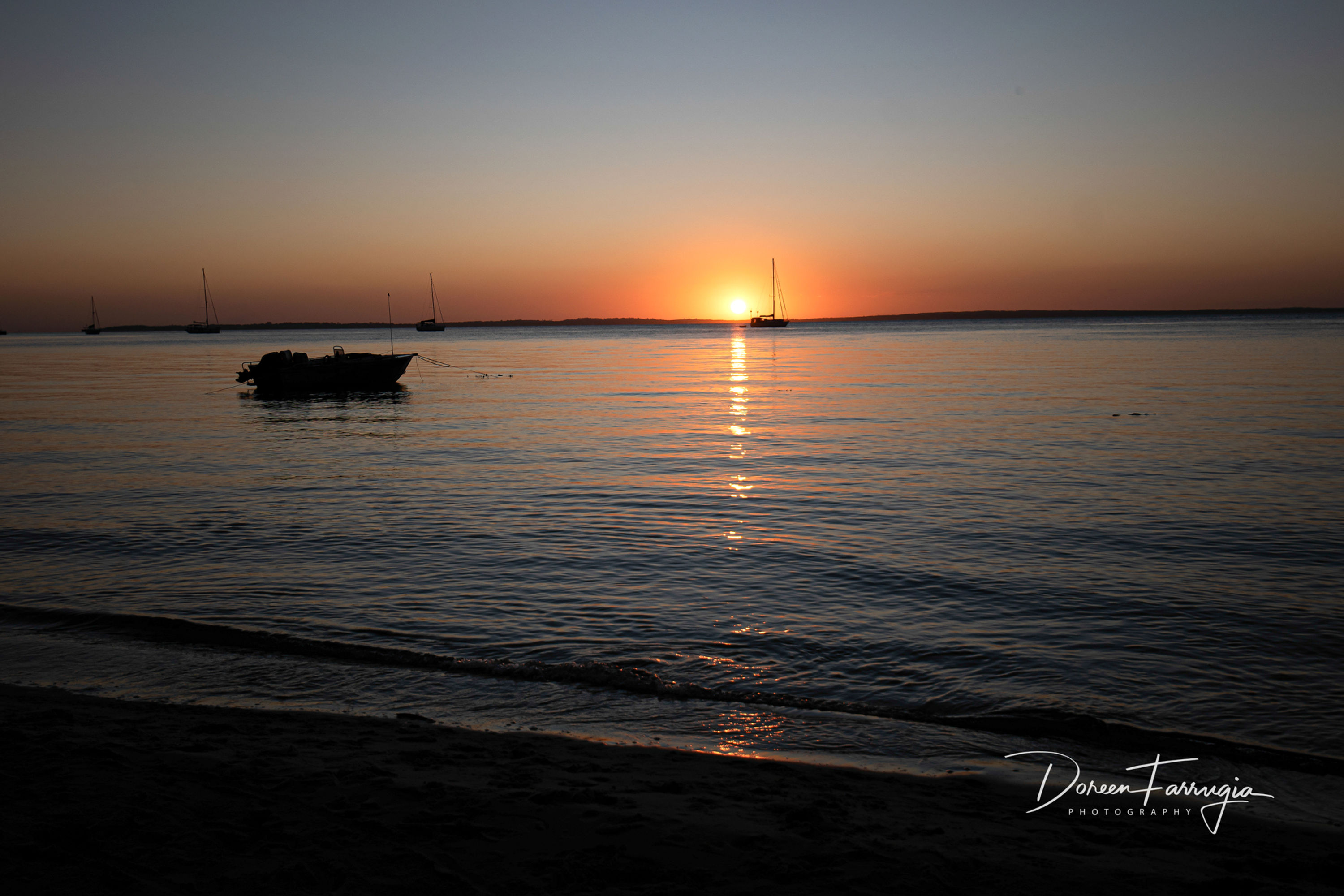 boat on the water at sunset