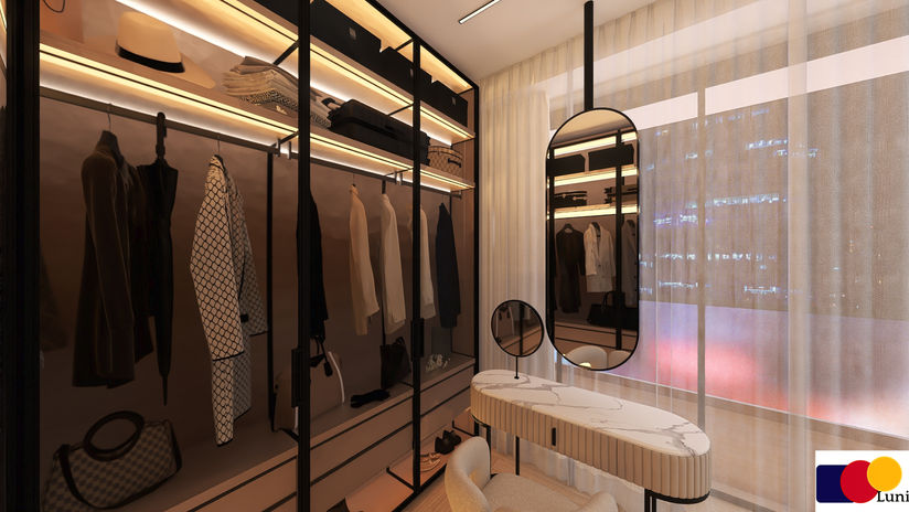 Contemporary walk-in closet featuring bespoke wardrobes, illuminated shelving, custom dressing table, and luxury interior design by Luni.